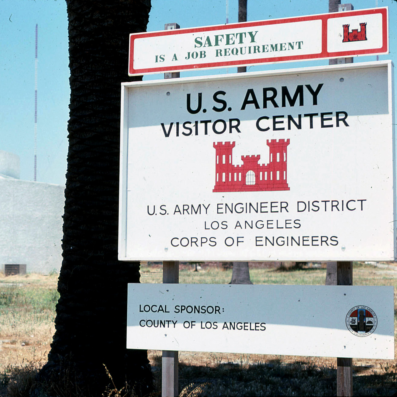 Red and white sign announcing a Corps of Engineers visitor center