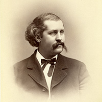 Portrait of man with mustache in a suit