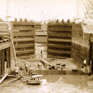 Two large lock and dam gates in an empty lock