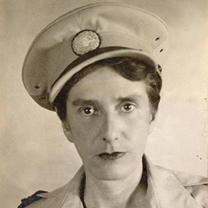 Portrait of a short-haired woman in military uniform and cap