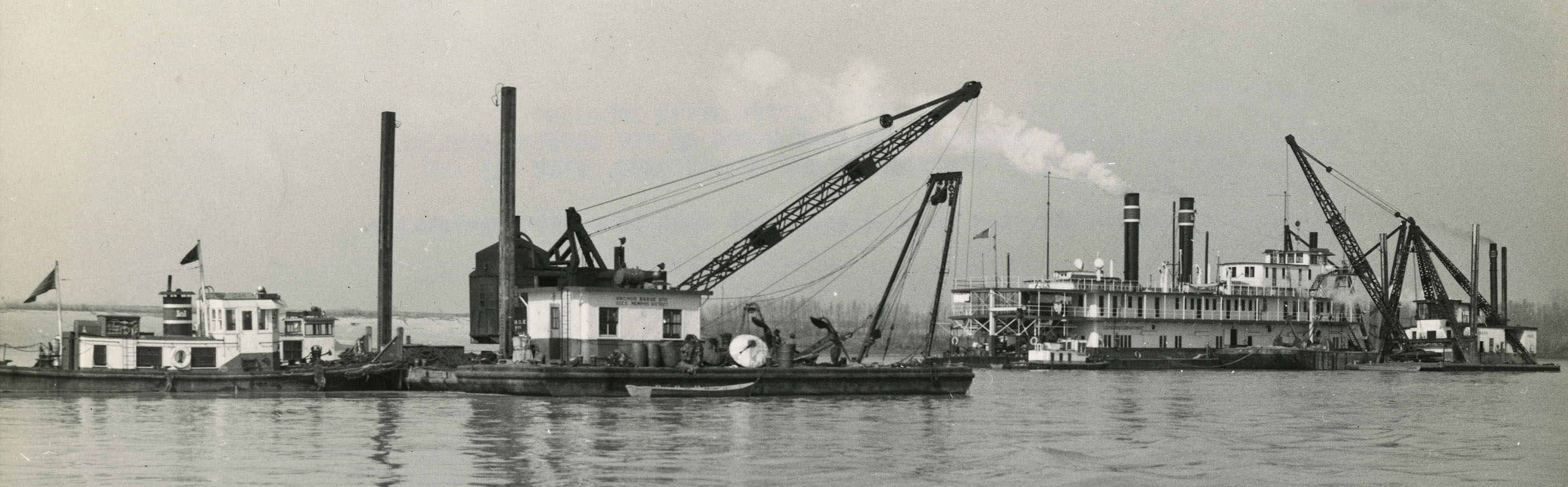 row of small and medium boats on a body of water row of small and medium boats on a body of water