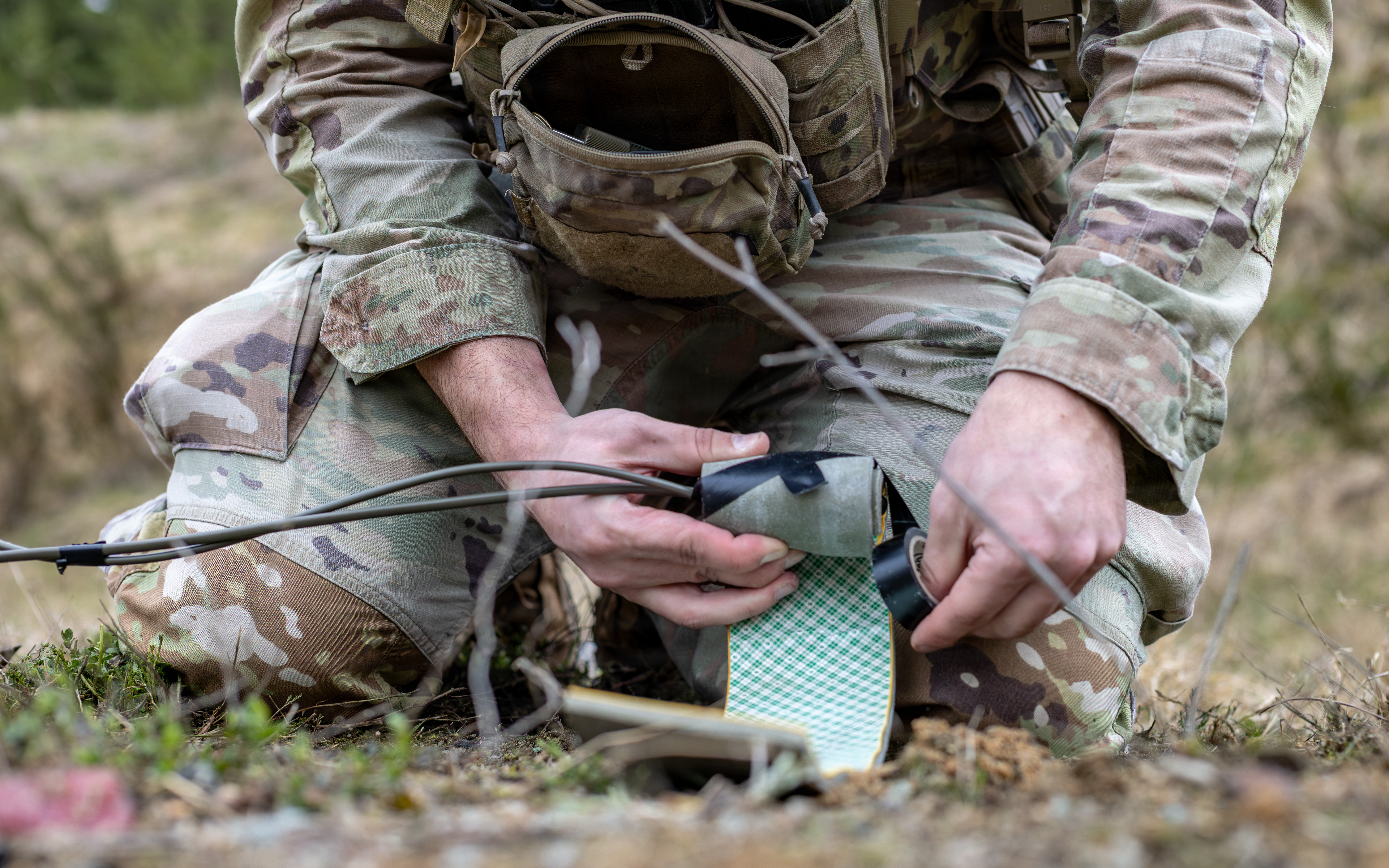 An Explosive Ordnance Disposal (EOD) technician assigned to the 702nd Ordnance Company, 18th Military Police Brigade, prepares a demolition charge on the EOD demolition range at U.S. Army Garrison Bavaria, Germany, April 15, 2026. The hands-on experience and training that military EOD technicians receive allows them to “fully grasp the hazards,” said Jim Hug, USACE ordnance and explosives safety specialist. 