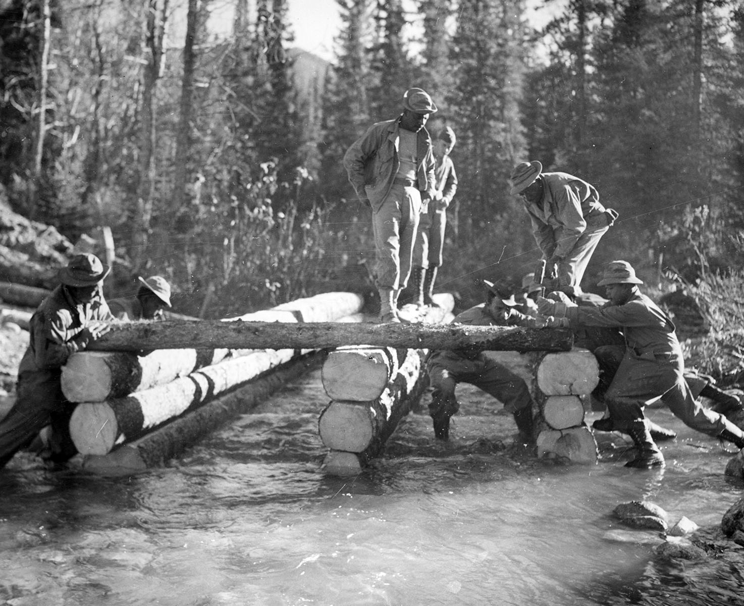 Black troops build log bridge