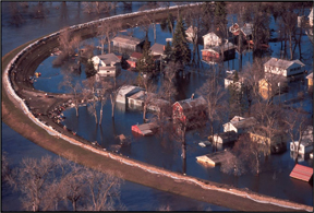 Flooding on both sides of a levee.