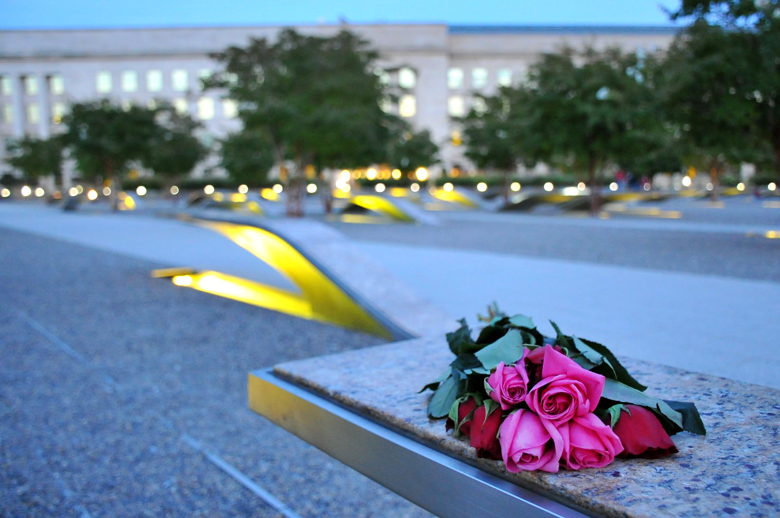 roses on a bench in front of the Pentagon building