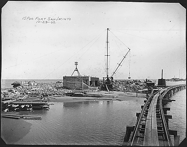 View of a fort being repaired, rail line in foreground View of a fort being repaired, rail line in foreground